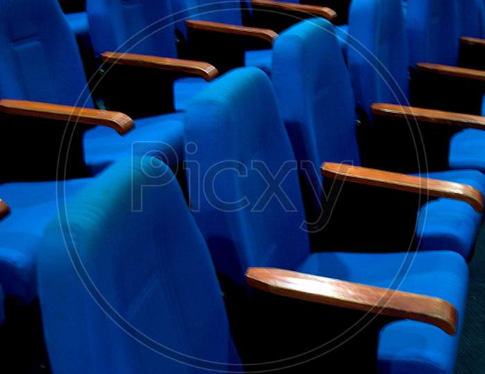 Rows Of Blue Cushioned Seats