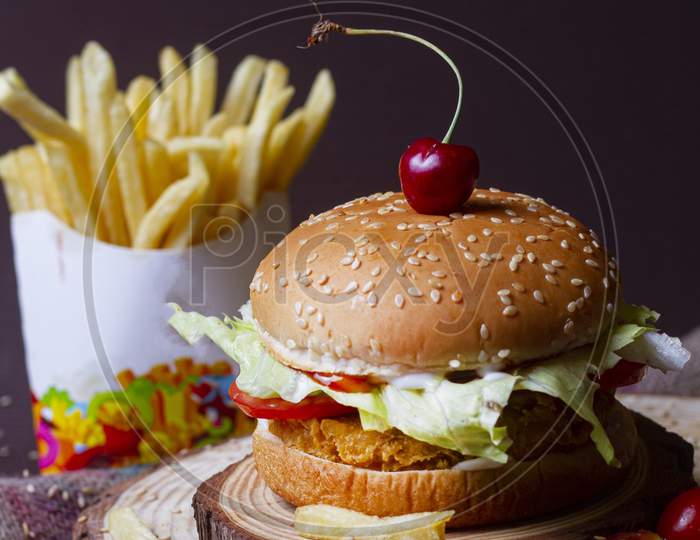 Juicy Mexican Burger, Hamburger Or Cheeseburger With One Chicken Patties, With Sauce,French Fries And Cold Drink. Concept Of Mexican Fast Food. Copy Space