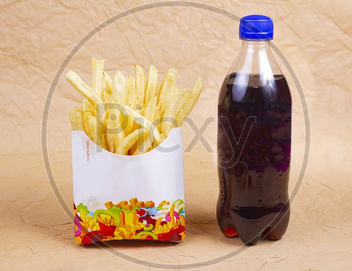 Cola And French Fries Isolated On Light Background