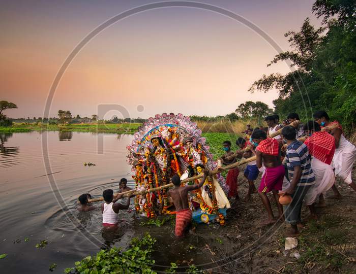Kolkata, West Bengal, India - 15 October 2021: Idol Of Goddess Durga Is Being Immersed In Holy River Ganges. Celebrated By Hindus As "Vijaya Dashami", Last Day Of Durga Puja Festival In Bengal.