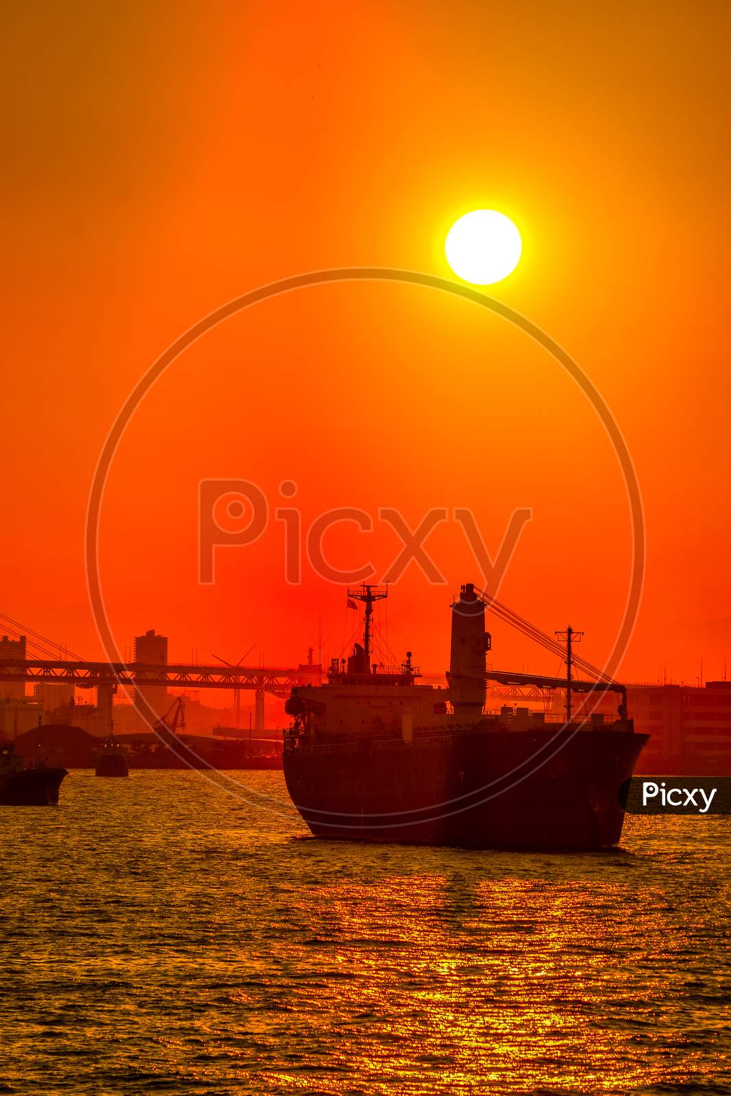 Cargo Ship Silhouette And Sunset