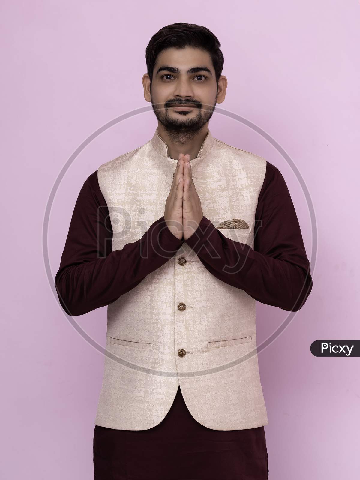 A Portrait Of A Indian Man In A Traditional Wear In Welcome Gesture Pose - Namaste.