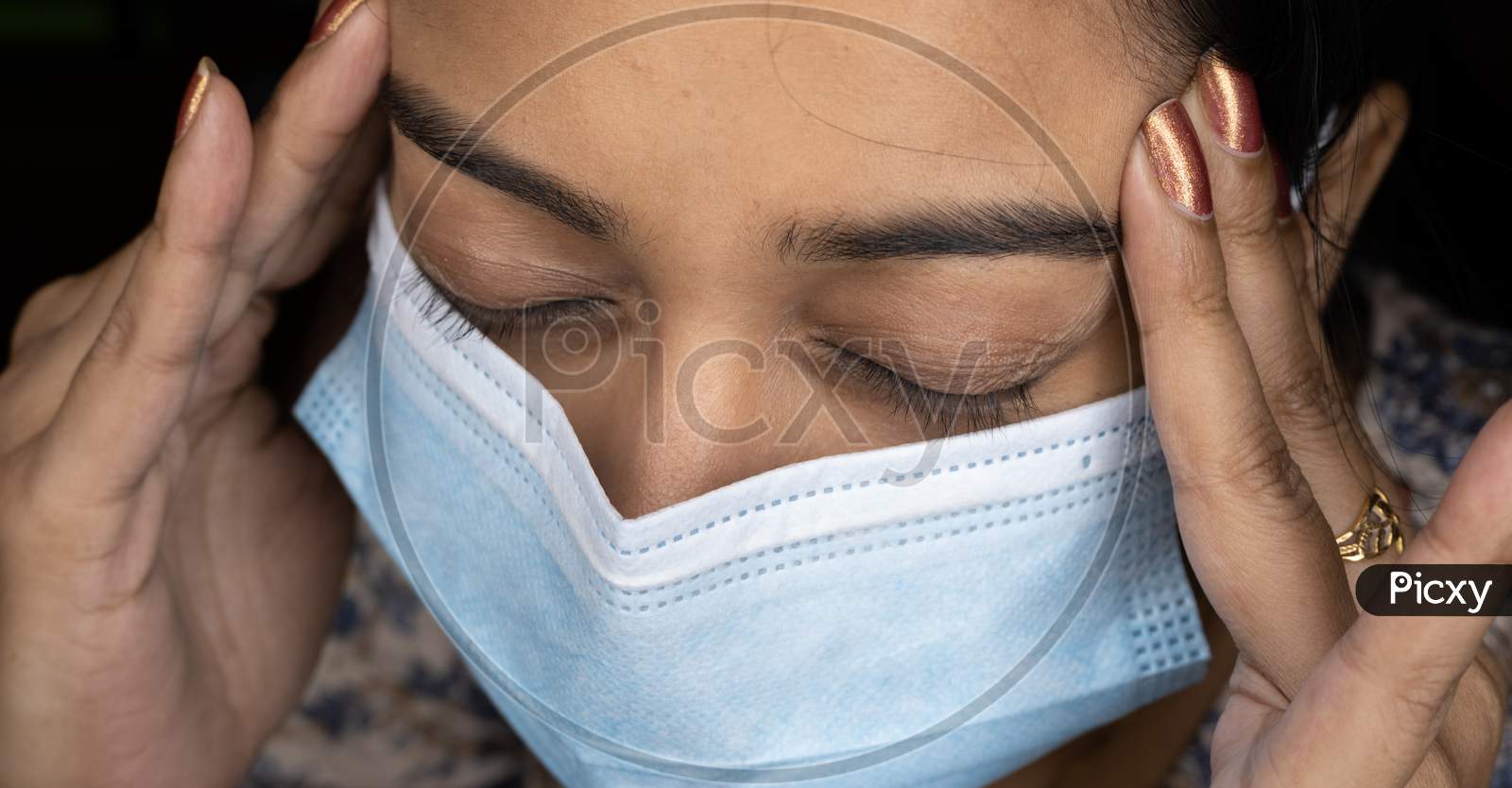 Girl Suffering From Headache Pain Due To Using Of Mask.