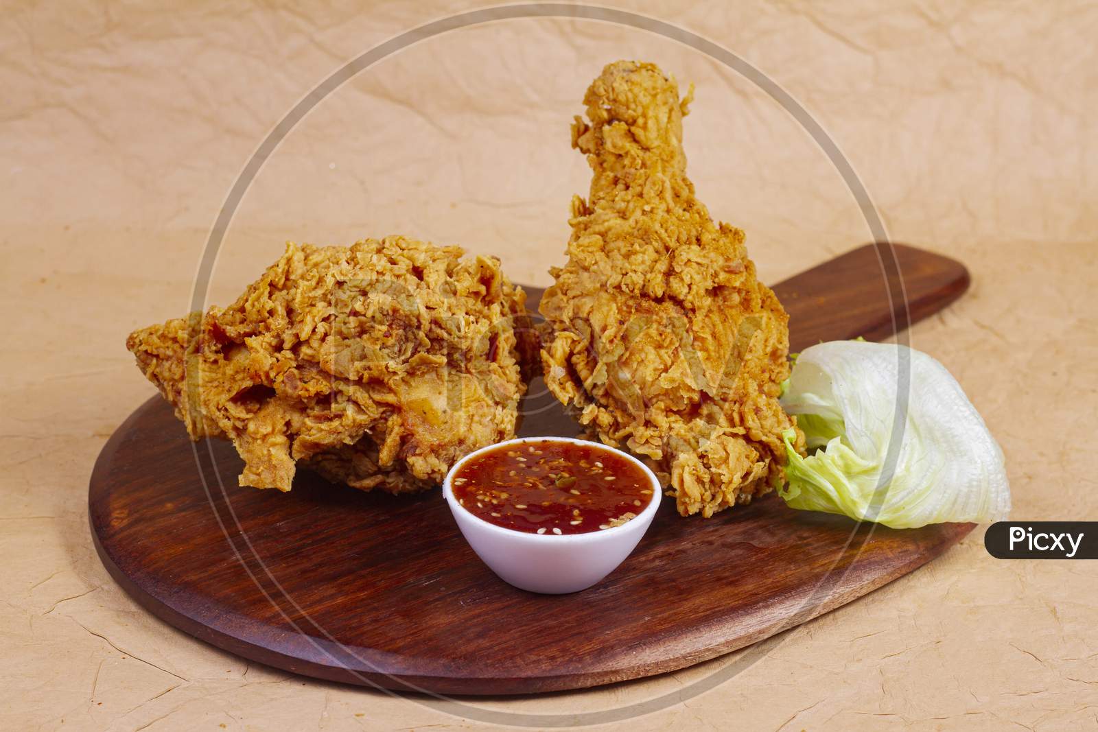 Hot And Crispy Fried Chicken Legs Isolated On A Wooden Wooden Platter