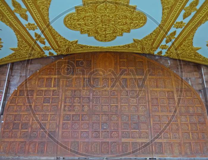 carved wooden door at global vipassana pagoda mumbai