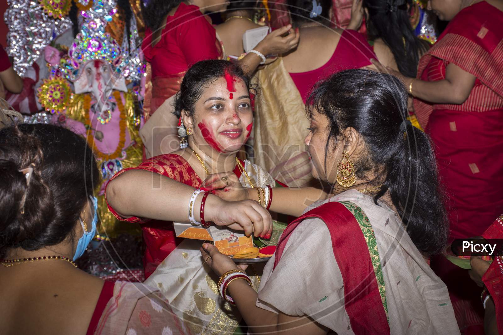 Kolkata, West Bengal, India - 16Th October 2021 : Bengali Married Women In Sari Playing Sindoor Khela, Traditional Bengali Ritual Before Immersion Of Goddess Durga. Selective Focus.