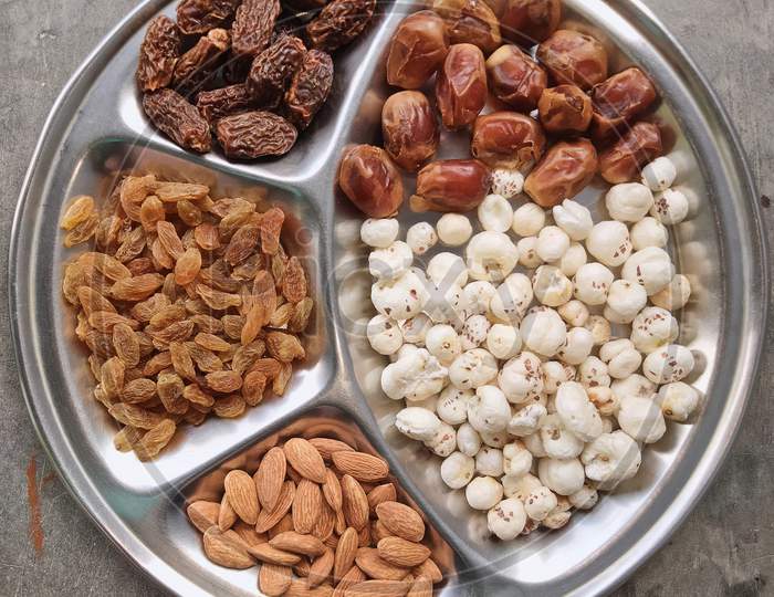 Dry fruits, Raisins, Foxnuts or lotus seeds, Almonds, Date, Dry dates