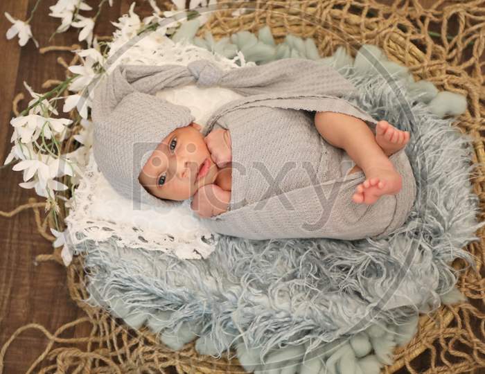 6 Months Old Little Sweet Arab Muslim Girl Laying And Posing On Comfy Wool Cute Face Top View