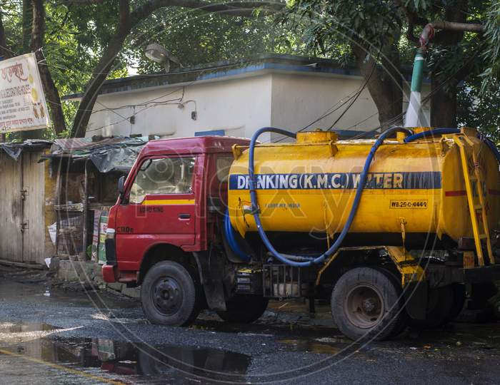 Kolkata, West Bengal, India - 16Th October 2021 : A Water Tanker Filling Water For Distribution. Selective Focus.A