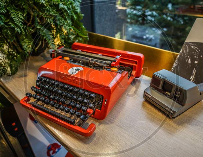 Red Typewriter And Instant Camera
