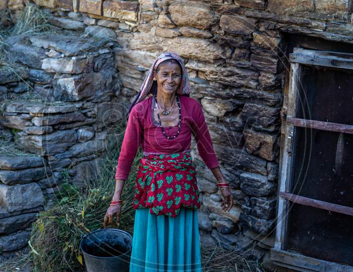 Almora, Uttarakhand- October 15 2021- Indian Woman Farmer, Working In The Cattle Farm. Indian Village Woman Working In The Morning.