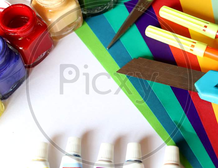 Art And Craft, Colour Papers,Wooden Brush, Water Colour,Knife And Scissors On A Desk