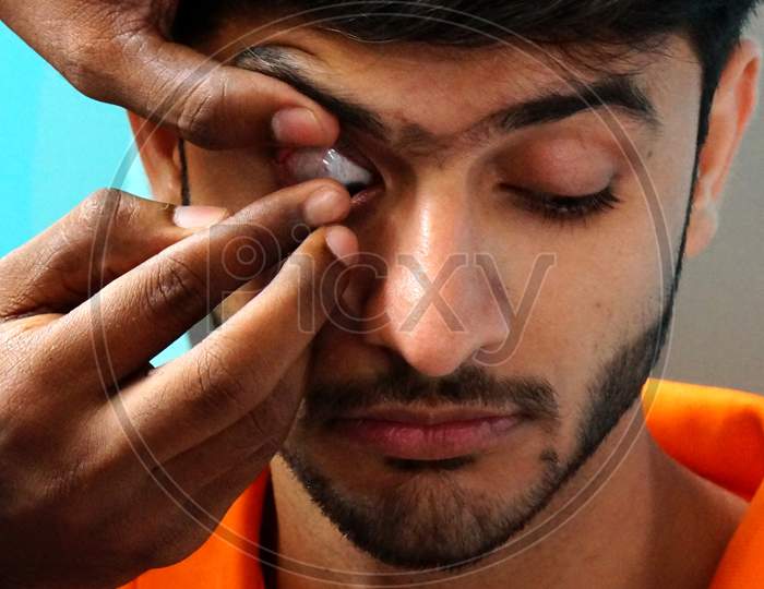 Indian Doctor Checking Patient Eye To Insert Contact Lens In A Clinic