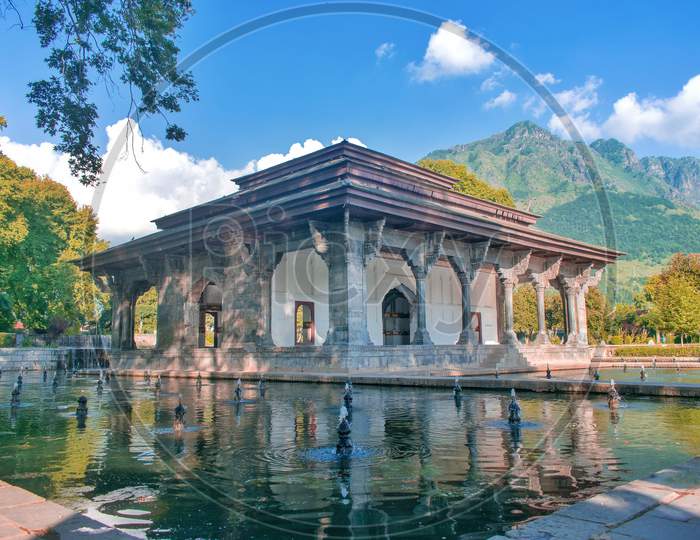 Shalimar Garden, Srinagar, Kashmir - 30th July 2019 Beautiful picture of a monument in world famous Shalimar garden in Srinagar, Kashmir with blue sky, mountains and water bodies around