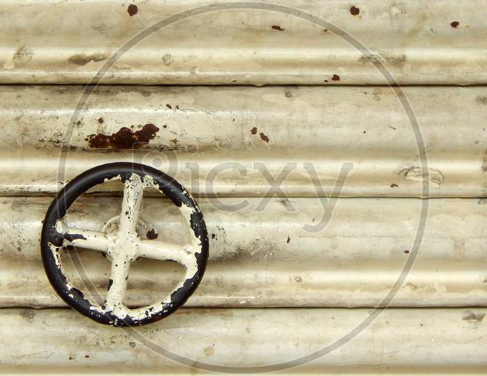 View Of Circular Handle Of Metal Roller Shutter Door