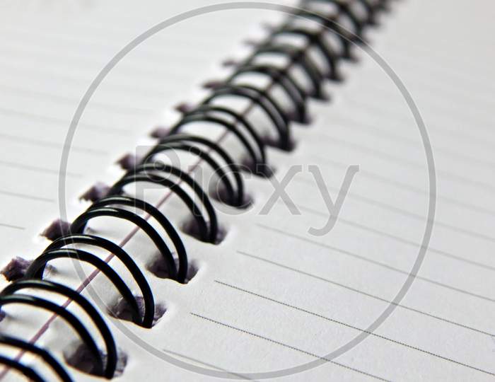 View Of A Spiral Bound Note With Lined Paper Sheets