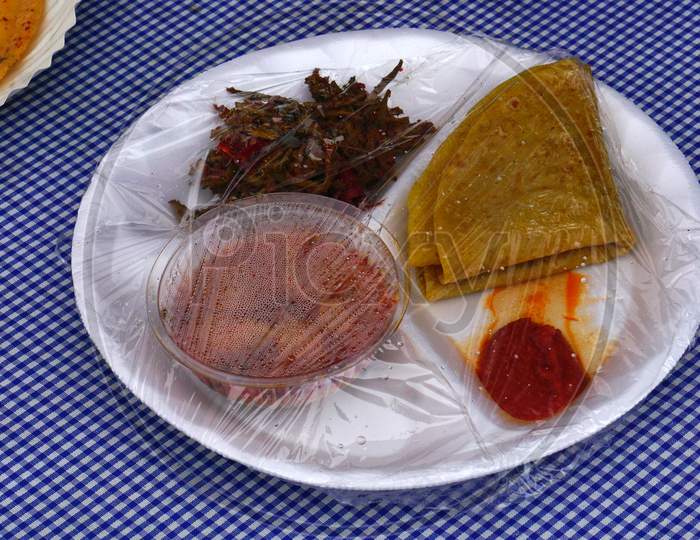 View Of Packaged Indian Street Food Chapathi,Curry, Pickle And Fried Vegetable Curry