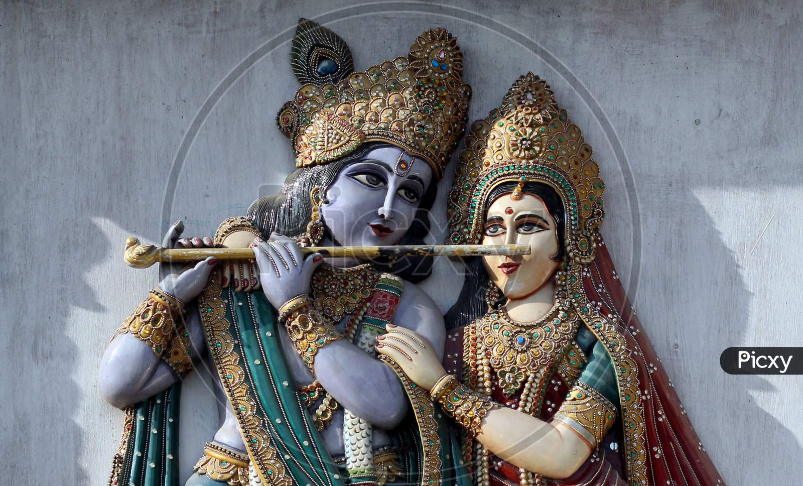 View Of Wooden Carved Indian Hindu God Krishna And Goddess Radha In A Temple