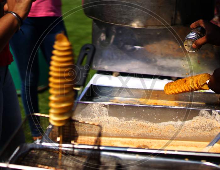 Making Indian Street Food Twisted Or Spiral Or Tornado Photo Chips