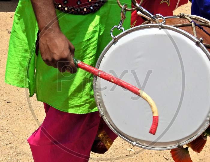 Ndian Hindu Man Playing Drum  During Religious Celebration