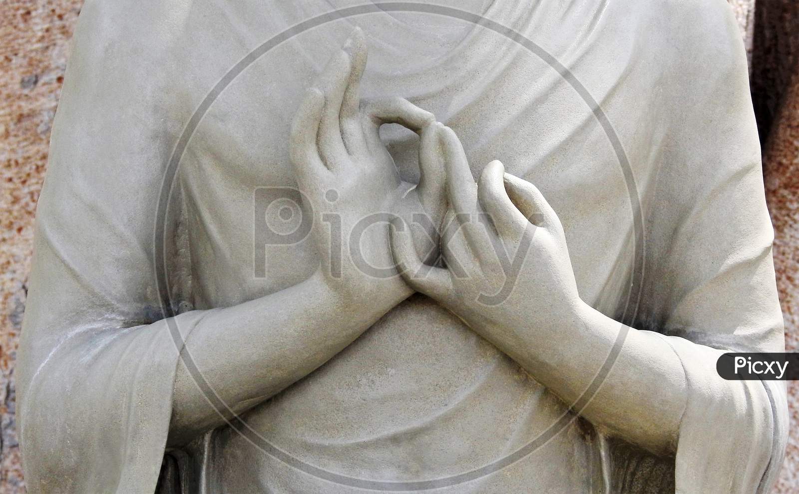 View Of Stone Carving Of God Buddha Hands In Meditating Pose ,In An Indian Monastry