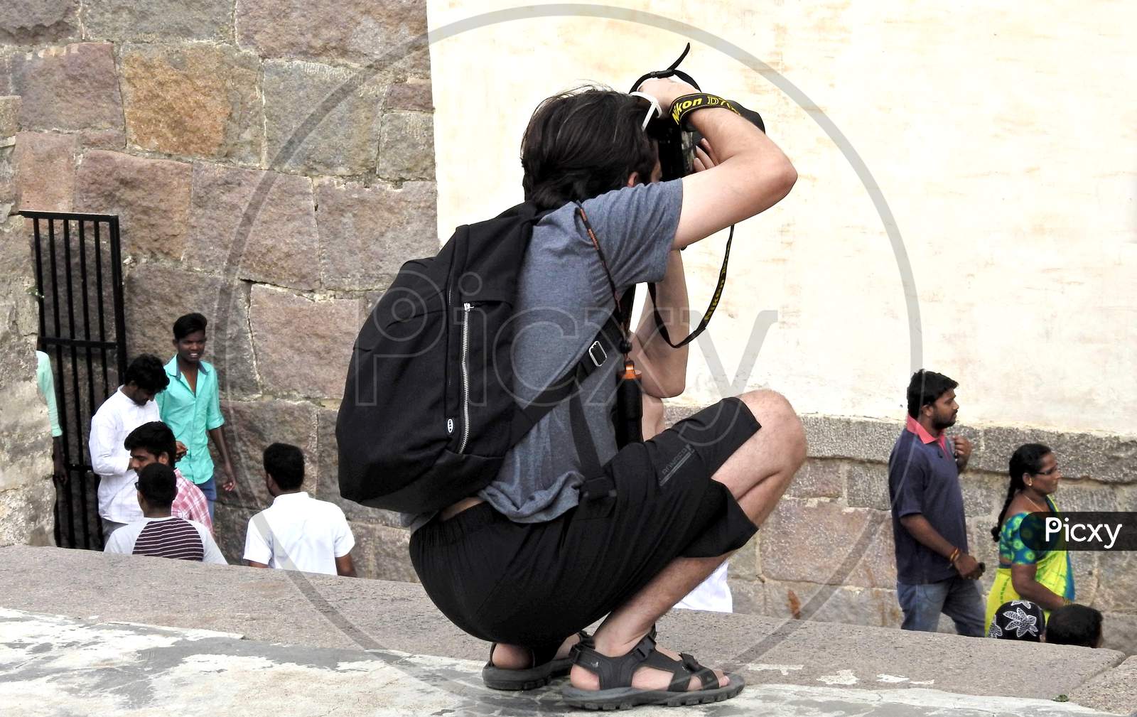 View Of Tourist Take Photo With Digital Camera In Golconda Fort