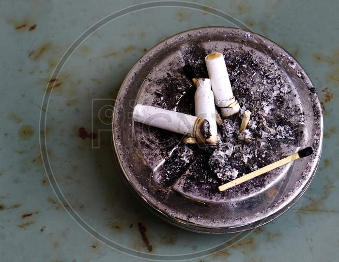 View Of Ash Tray With Cigarette Butts And Match Sticks ,No Smoking Concept