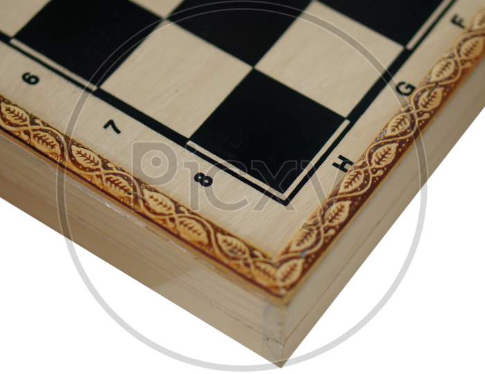 View Of A Wooden Chess Board With Squares And Pieces In Side