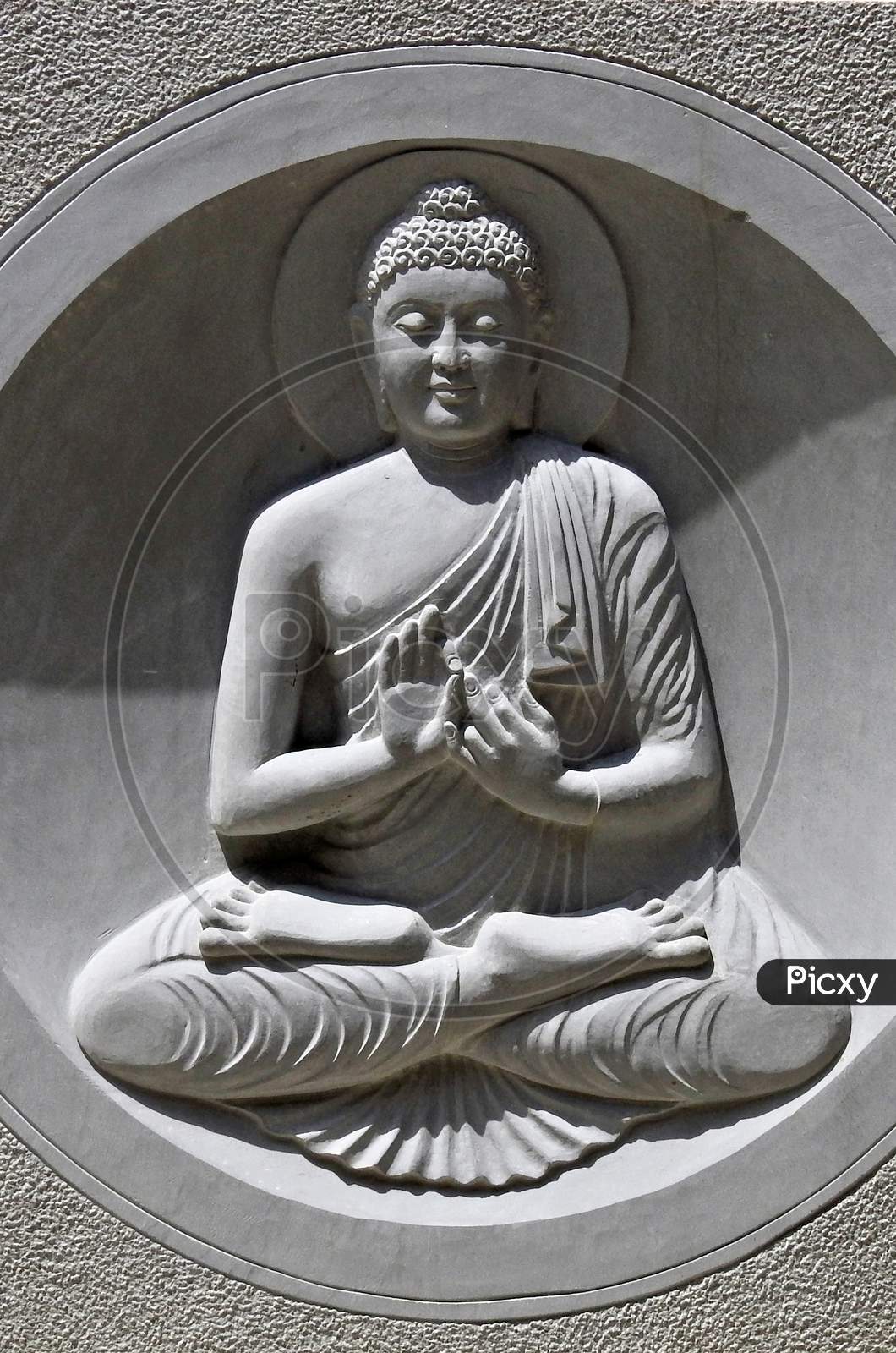 View Of Stone Carving Of God Buddha In Meditating Pose In An Indian Monastry