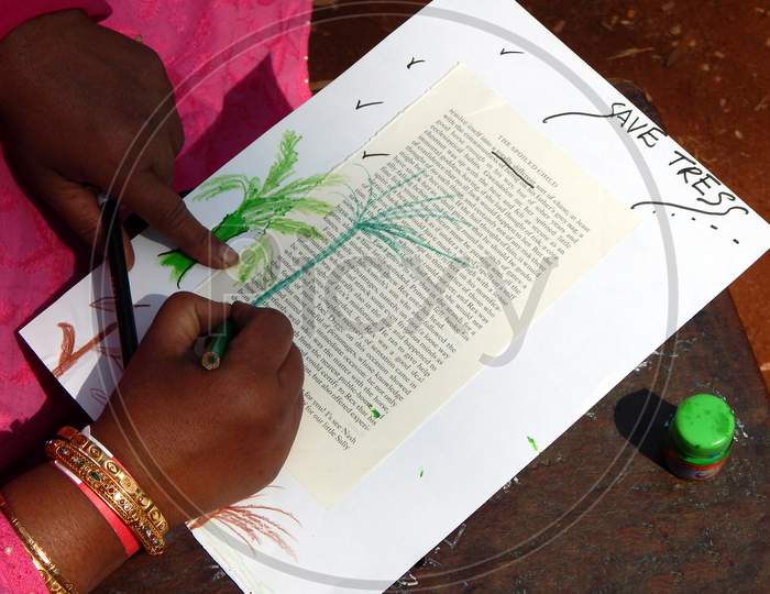Indian Child Painting With Color Pencils,  In Outdoors, On Old Printed Paper