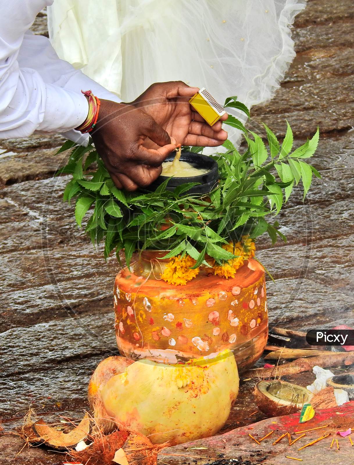Ndian Hindu Man Lighting The Oil Lamp On Bonam, Afood Offering To Goddess Durga During Bonalu Festival,On The Way To Temple