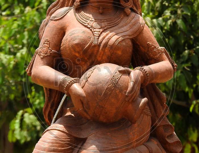 View Of A Statute Of Indian Tradtional Woman Fetching Water In A Pot