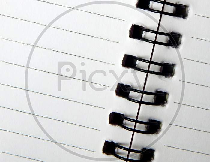 View Of A Spiral Bound Note With Lined Paper Sheets