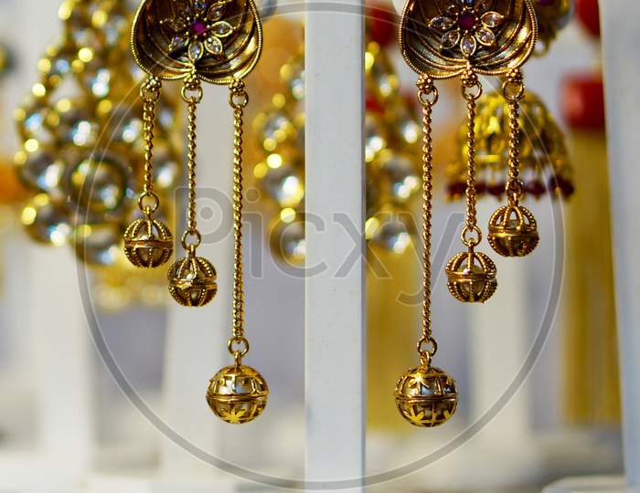 Indian Woman Artificial Or Imitation Jewlry Ear Hangings In Shop Display