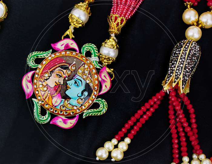 Indian Hindu Woman Jewelry Locket With Krishna And Radha Image On Locket Of Necklace
