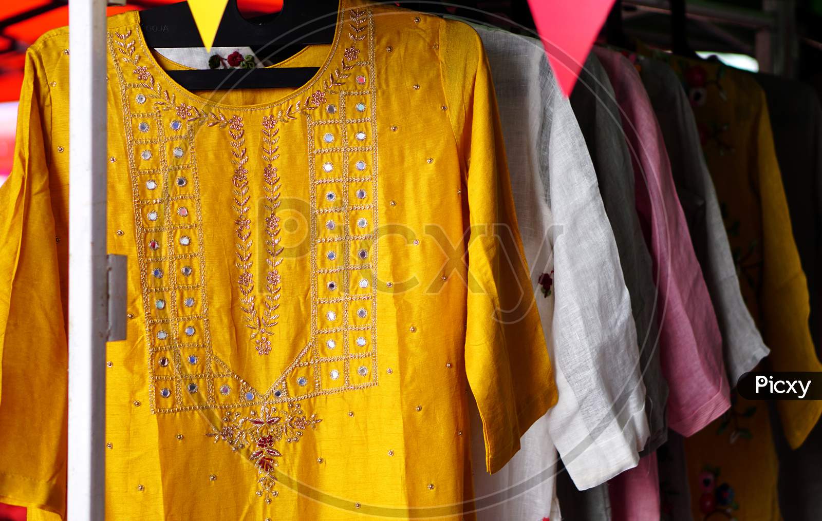 Indian Woman Fashion And Tradition Wear Salwar Kameez Hung In Shop Display