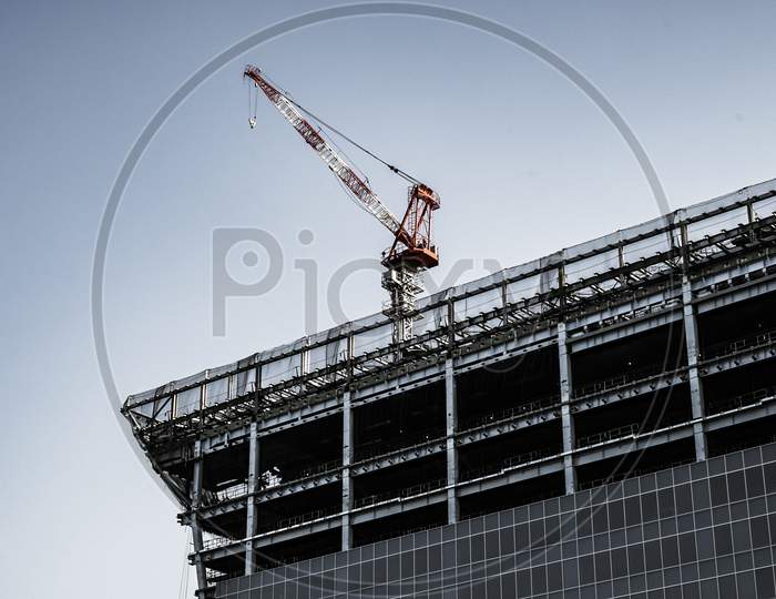 Building And Large Cranes Under Construction
