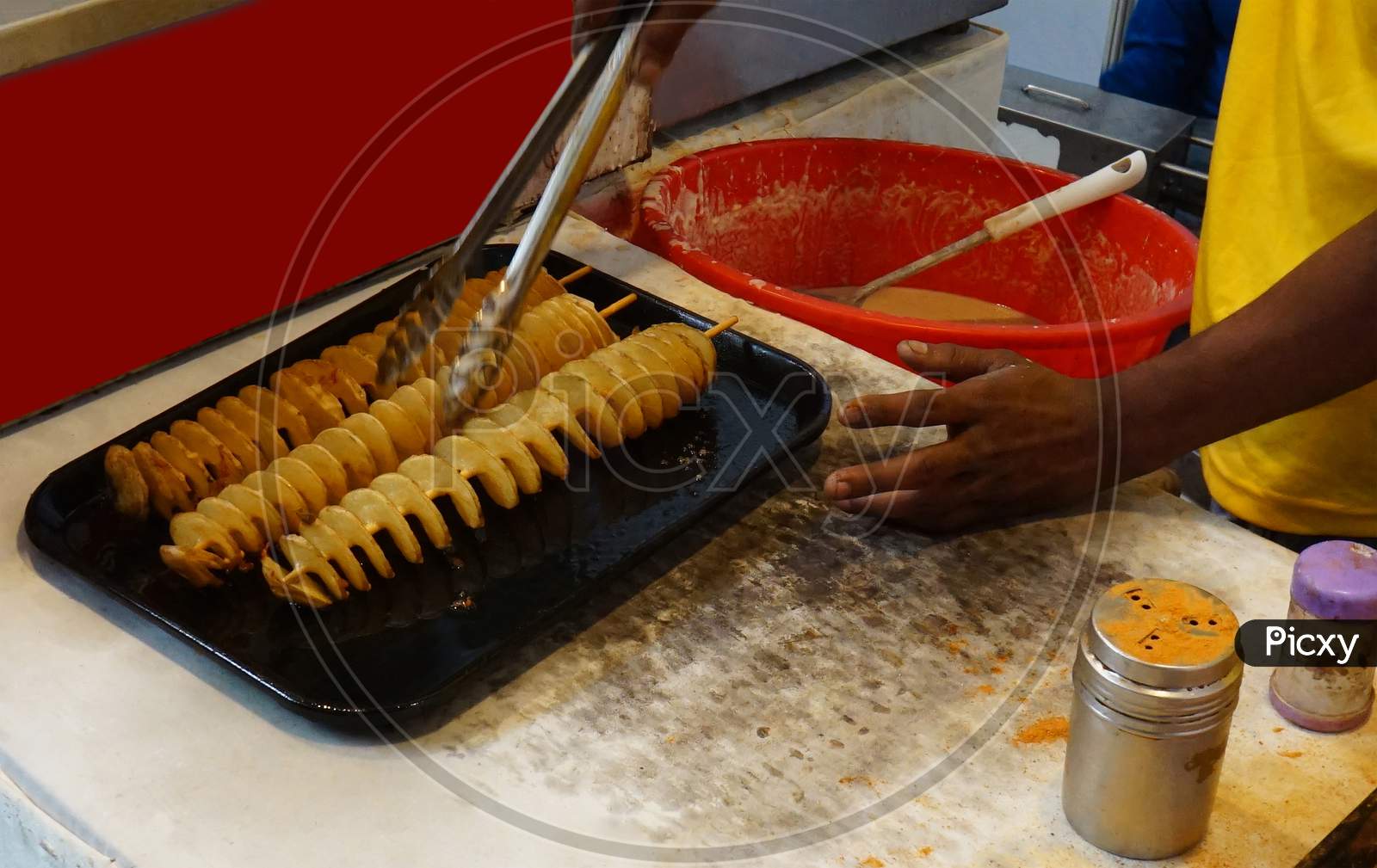 Indian Street Food Vendor Making Twisted Or Tornado Potato Chips