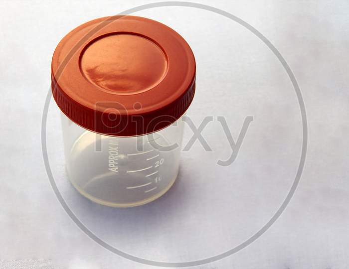 View Of  Empty Plastic Container For Taking Urine Samples Of Patient In Pathology Laboratory