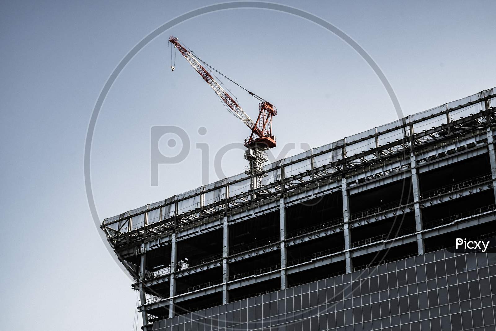 Building And Large Cranes Under Construction