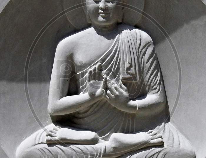 View Of Stone Carving Of God Buddha In Meditating Pose In An Indian Monastry