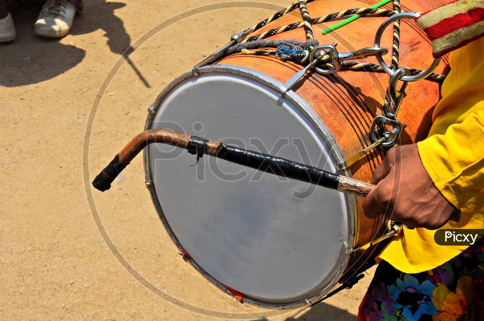 Indian Hindu Man Playing Drum  During Religious Celebration