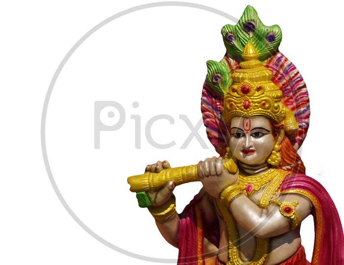 Indian Hindu God Sri Krishna Playing Musical Instrument Basuri Or Flute