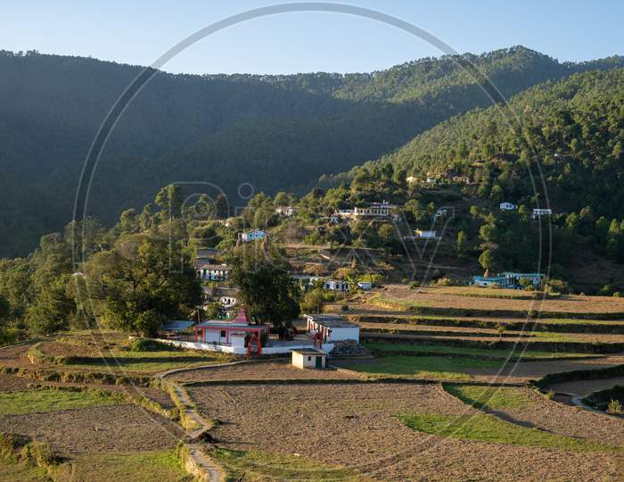 Beautiful Scenic Landscape Of A Village Based In Between The Mountains Captured During Sunset. Indian Village Situated In The Hills Of Almora.