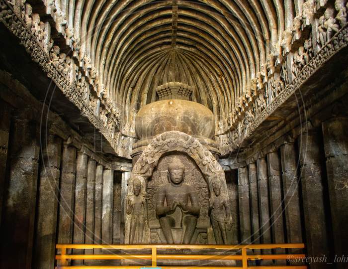 The picture shows rich sculpture of lord Gautam Buddha meditating at world heritage site of Ellora caves, India
