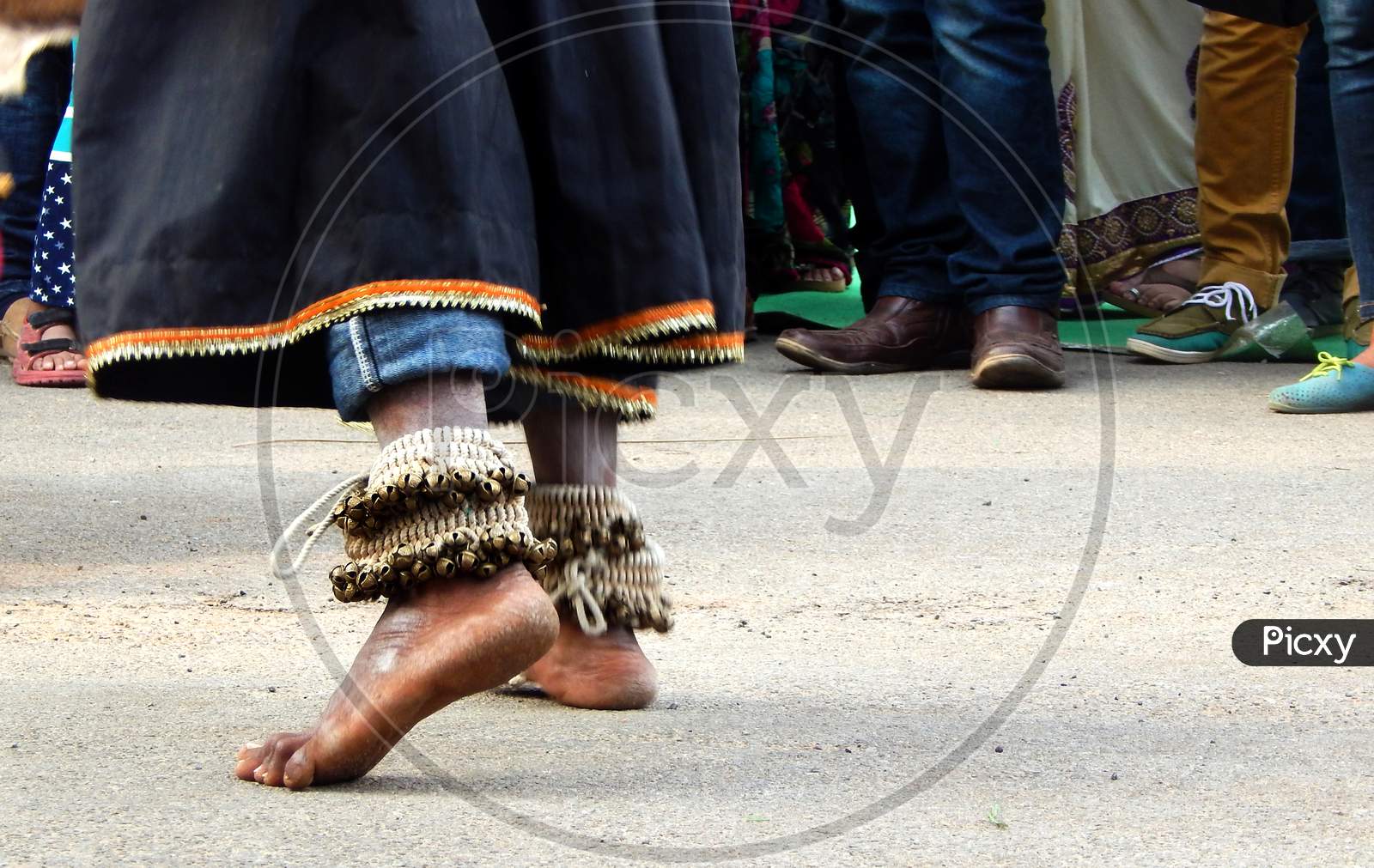 View Of Legs With Bells Tied Of Indian Tribal Dancer Performing In Outdoors