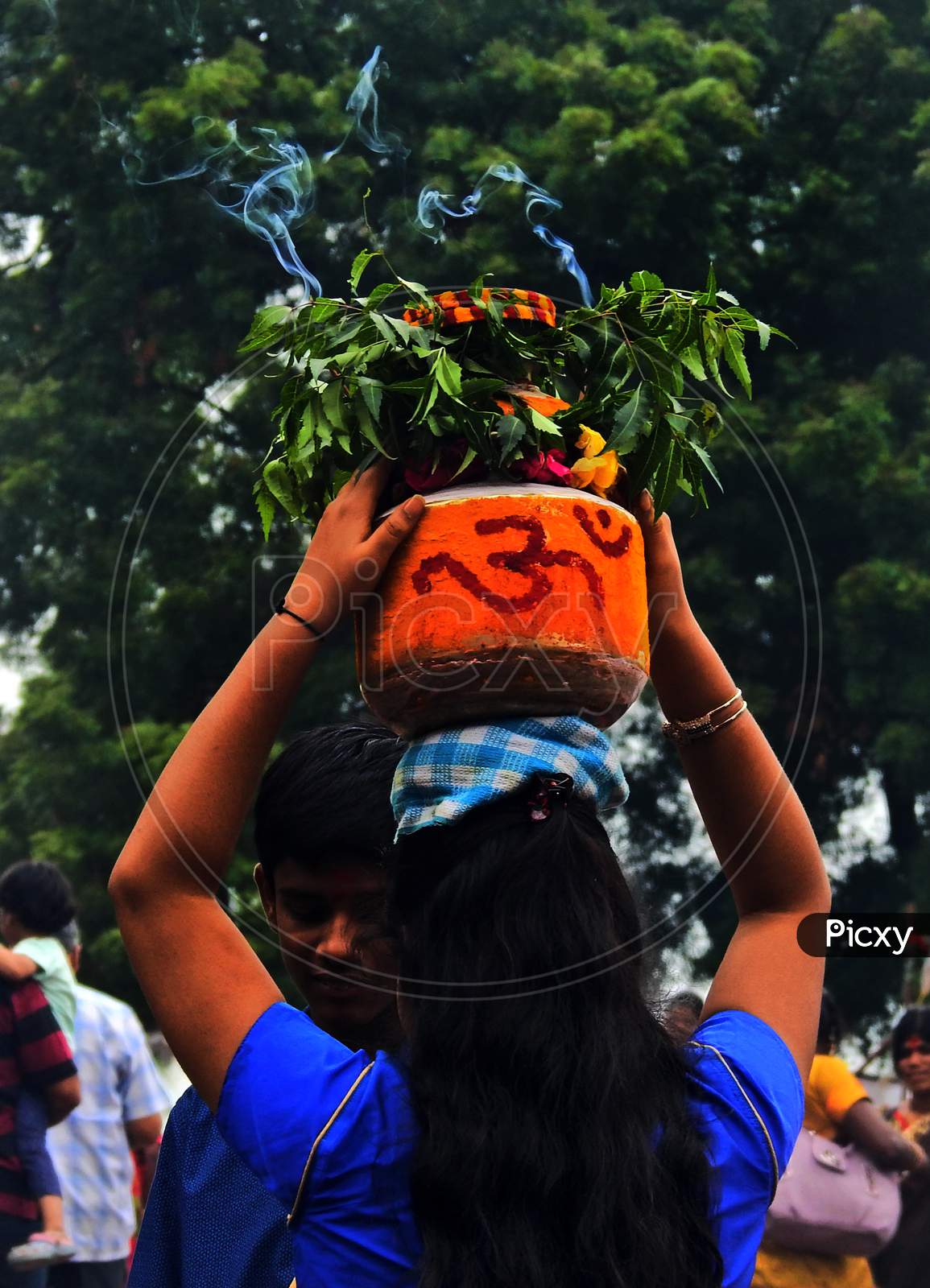 Indian Hindu Woman Carry Bonam To Temple, A Food Offering To Goddess Durga During Bonalu Festival