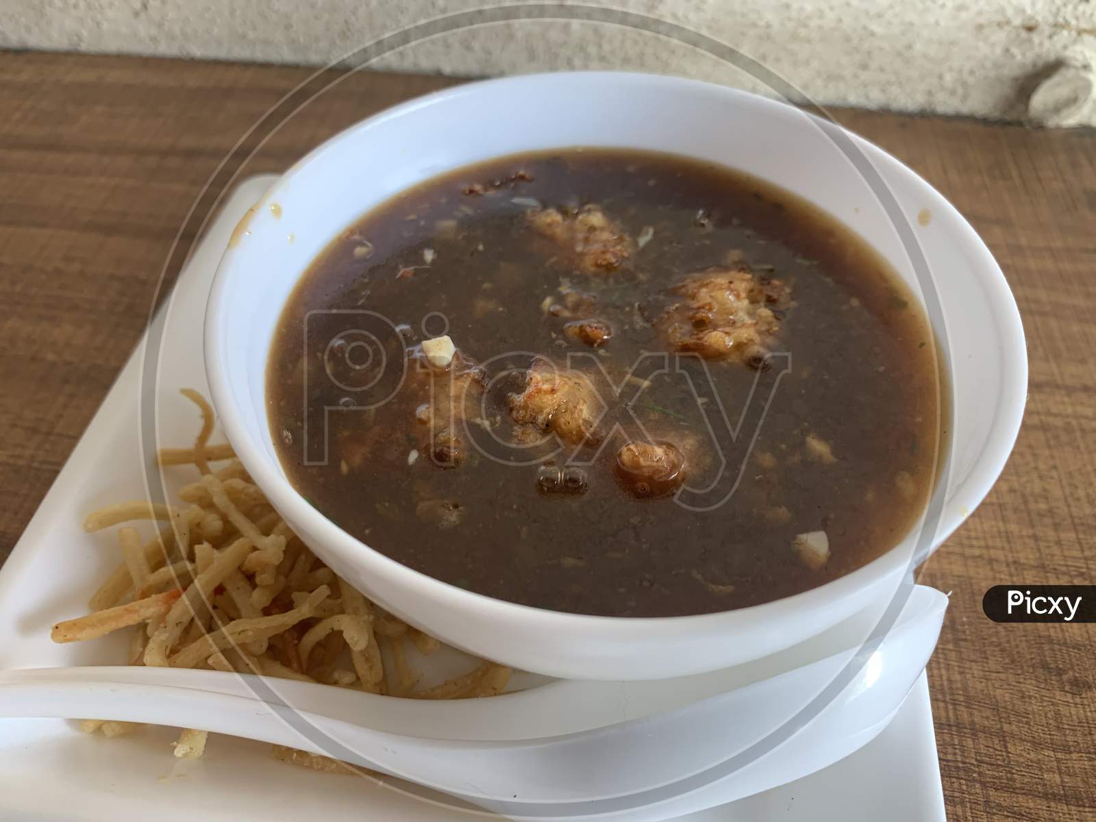 Manchow soup, indo chinese dish with manchurian balls.
