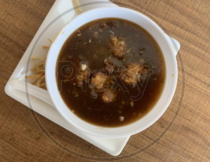 Manchow soup, indo chinese dish with manchurian balls.