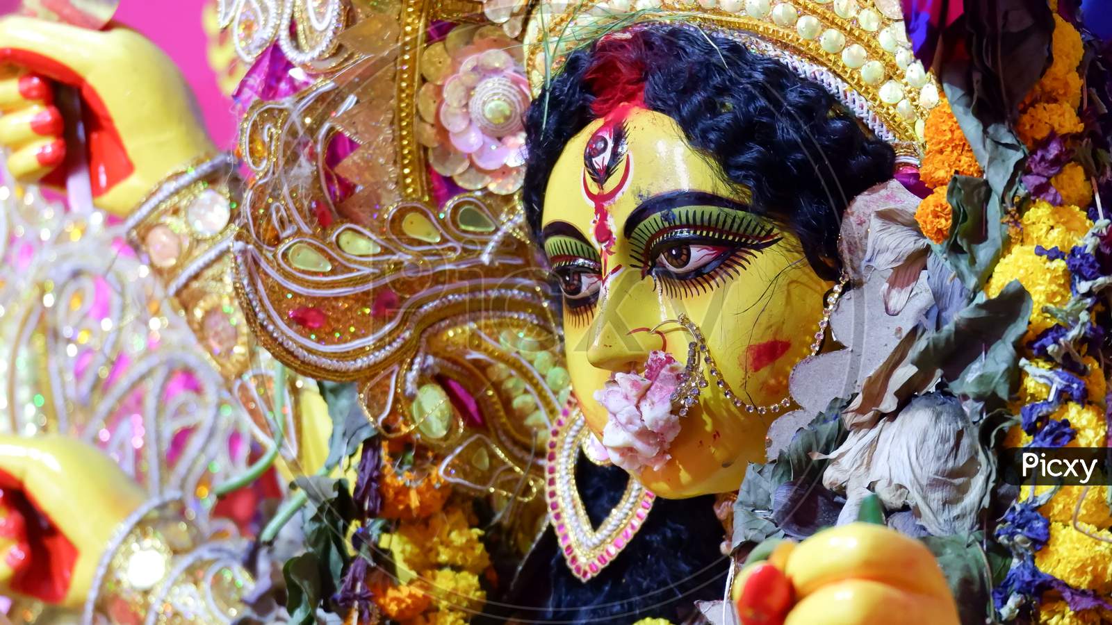 Goddess Maa Durga Face With Sindur And Sweets As Per Hindu Rituals For Devi Boron Or Saying Good Bye.